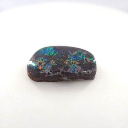 6.72 Ct Boulder Opal Freeform Cabochon – Multicolor Fire on Dark Matrix