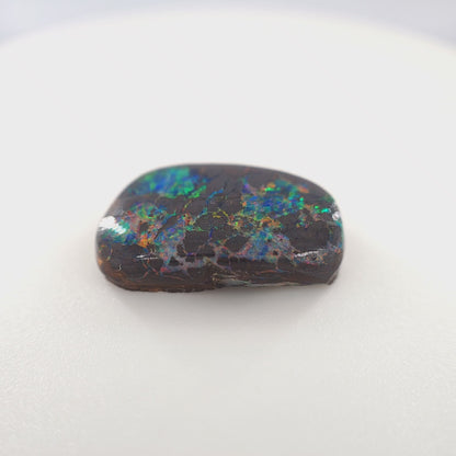 6.72 Ct Boulder Opal Freeform Cabochon – Multicolor Fire on Dark Matrix